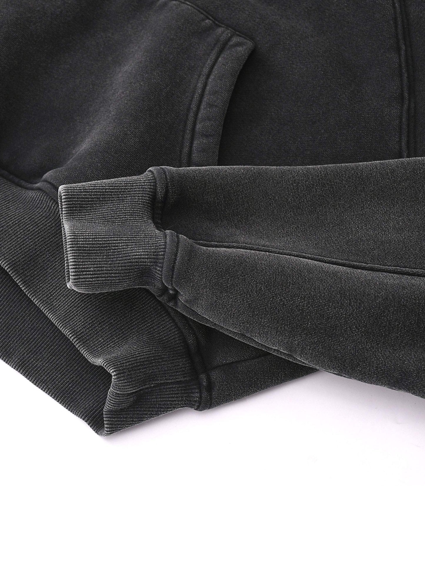 Cropped black hoodie with ribbed cuffs from the Fearless Apparel Line.
