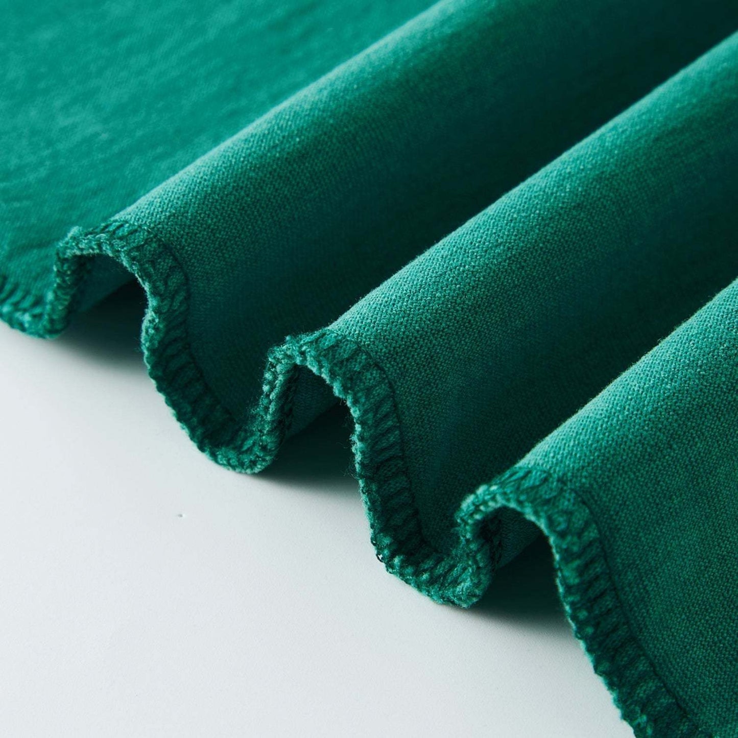 Heavyweight drop shoulder vintage top in teal fabric, embodying fearless style.