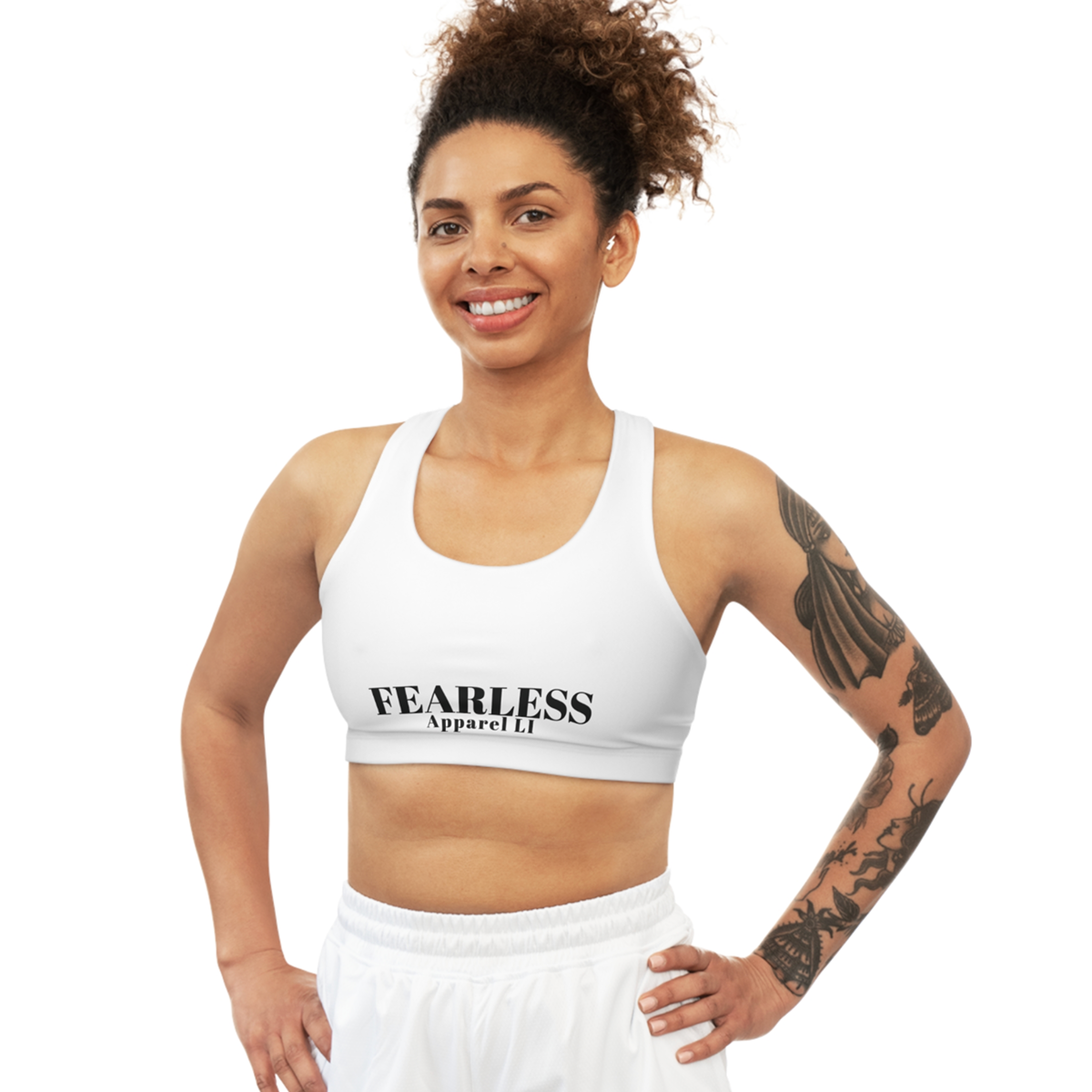 Seamless Sports Bra Fearlessli in white worn by a smiling person, perfect for gym or everyday activities.