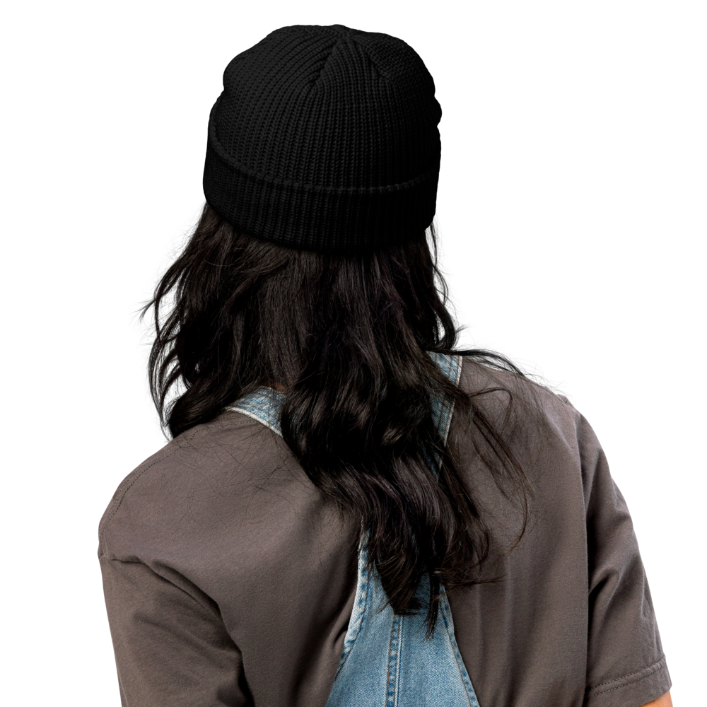 FearLessLi knitt beanie hat in black, showcased on a person with long hair wearing a denim overall.