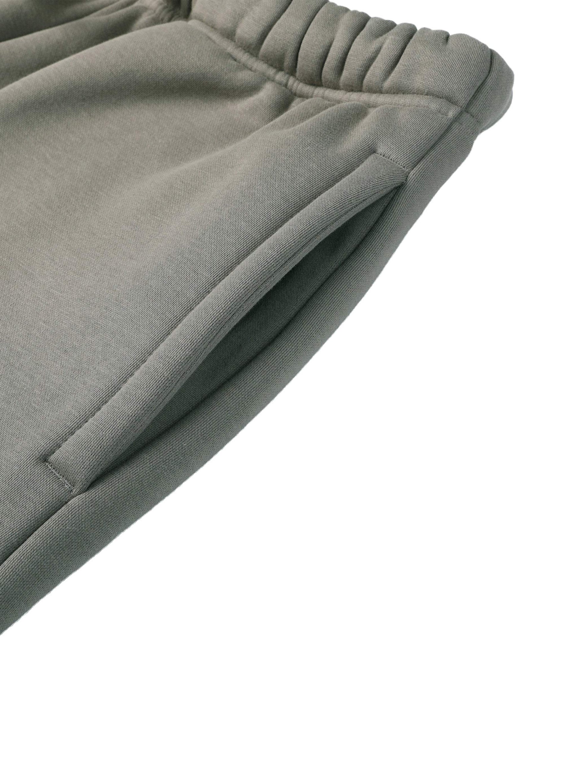 Fearless Apparel Line Street Drawstring Sweatpants in green, showcasing elastic waistband and pocket detail.