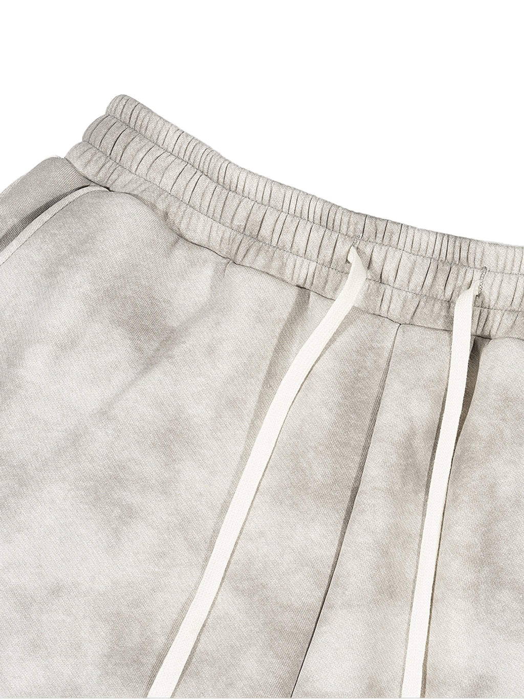 Dirty washed fleece sweatpants in grey with drawstring, displaying relaxed fit and versatile style.