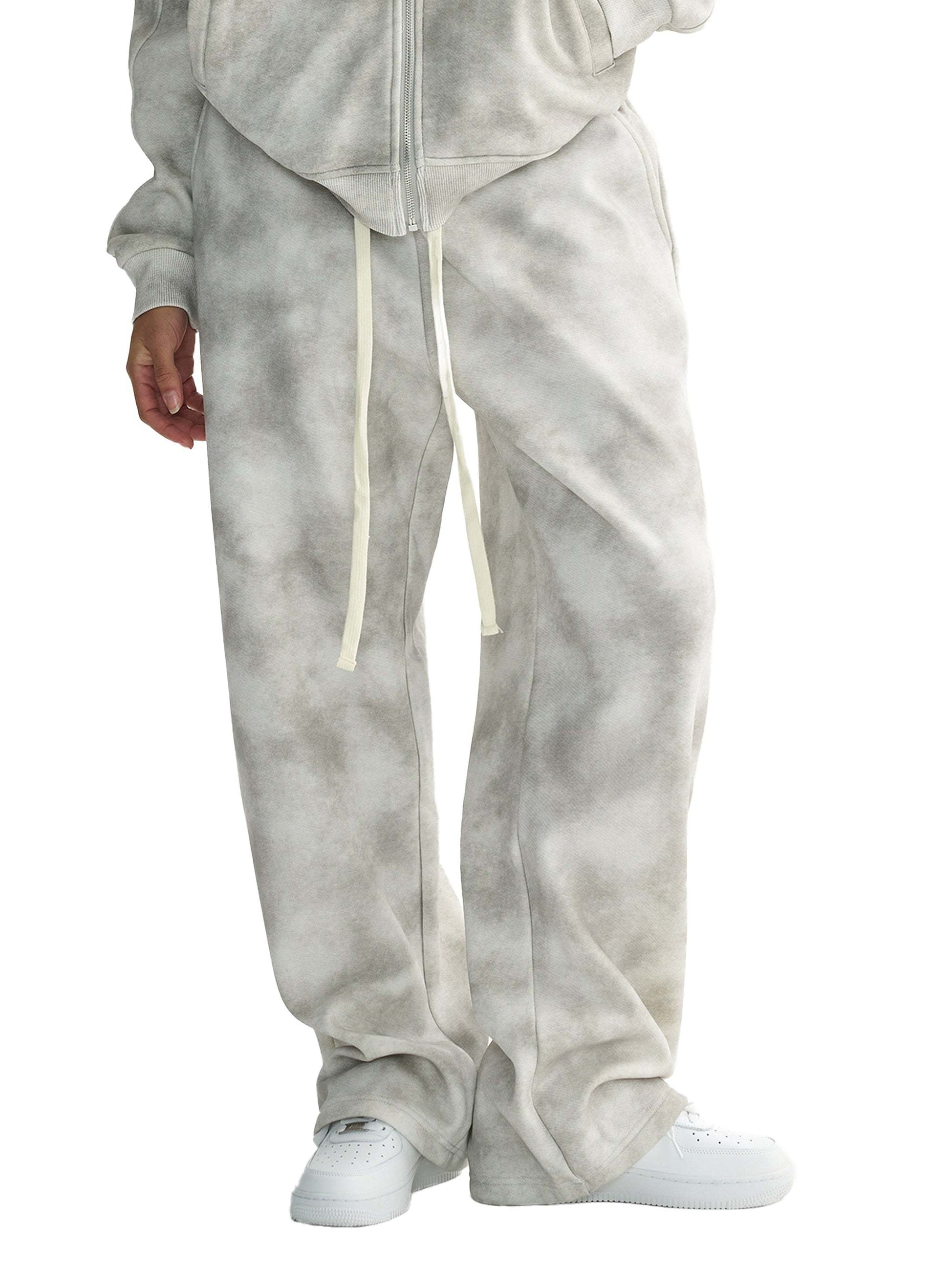Dirty washed fleece sweatpants in a relaxed and loose fit, featuring a versatile grey color and drawstring.