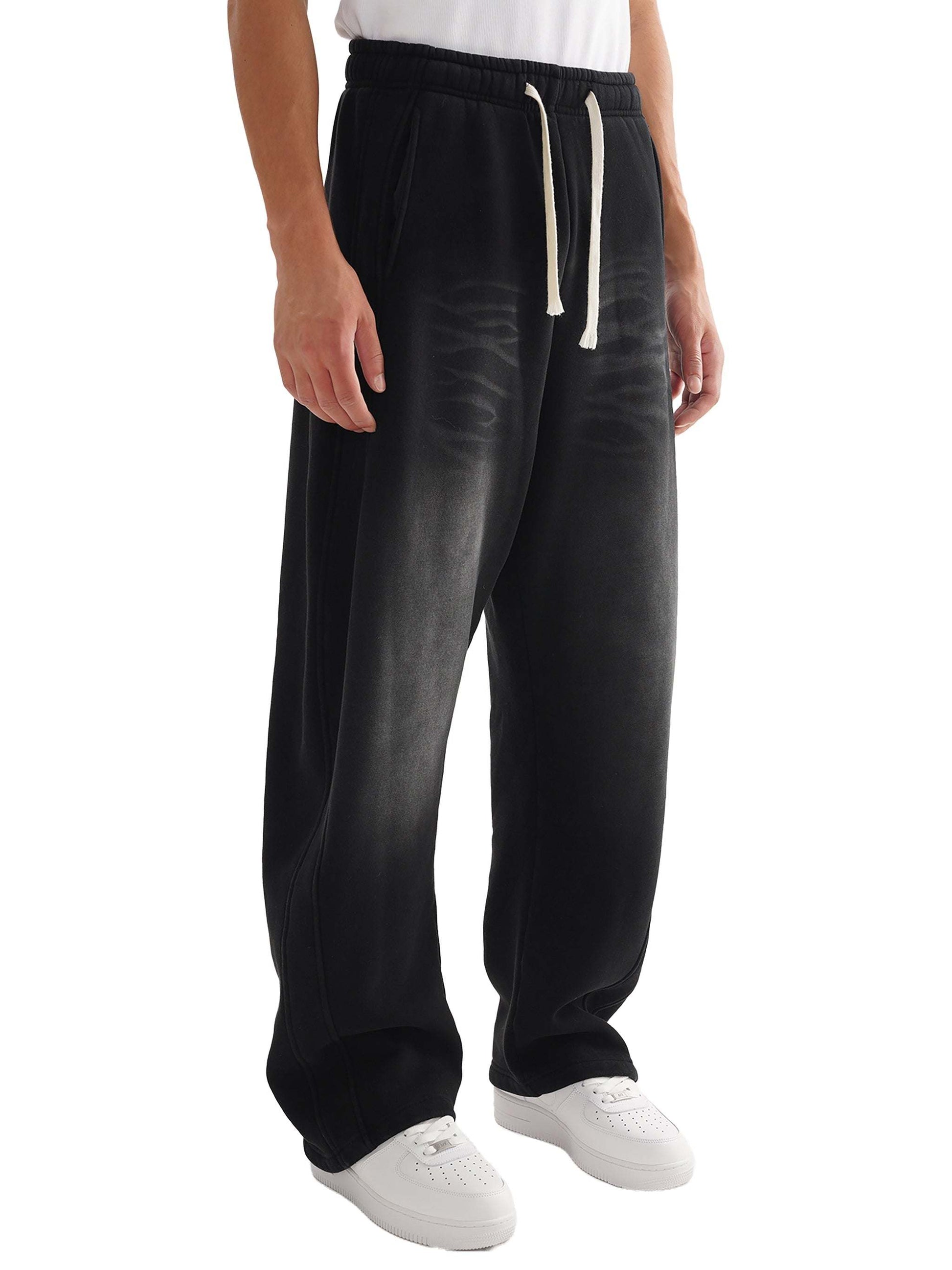 Black Sunfade Curved Blade Sweatpants, regular fit, gender-neutral design, with white drawstring.