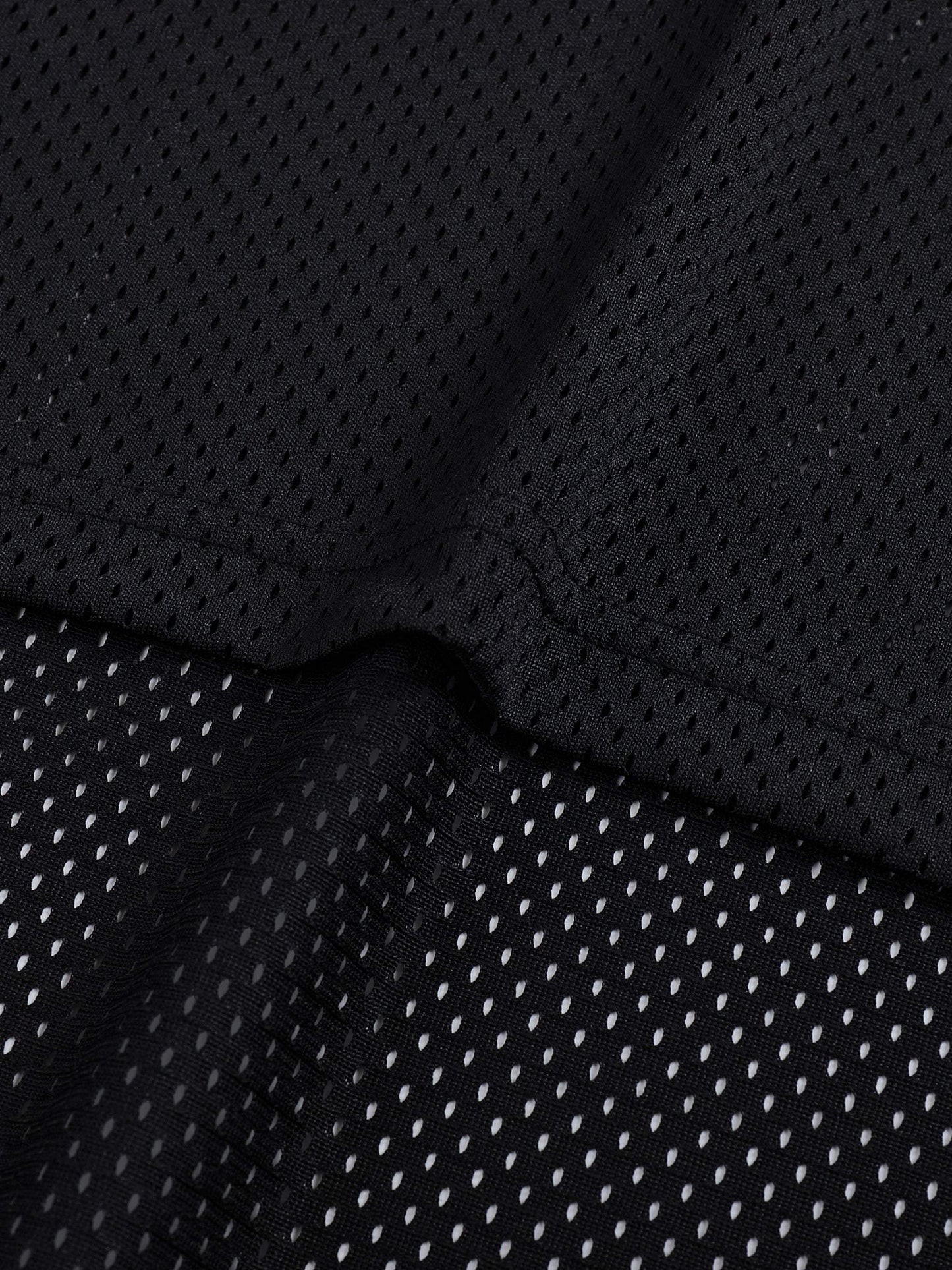 Unisex black mesh fabric of Taped Mesh Boxy T-shirt, featuring breathable polyester material with a sporty and casual design.